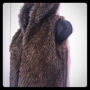 Faux fur vest with matching boots.